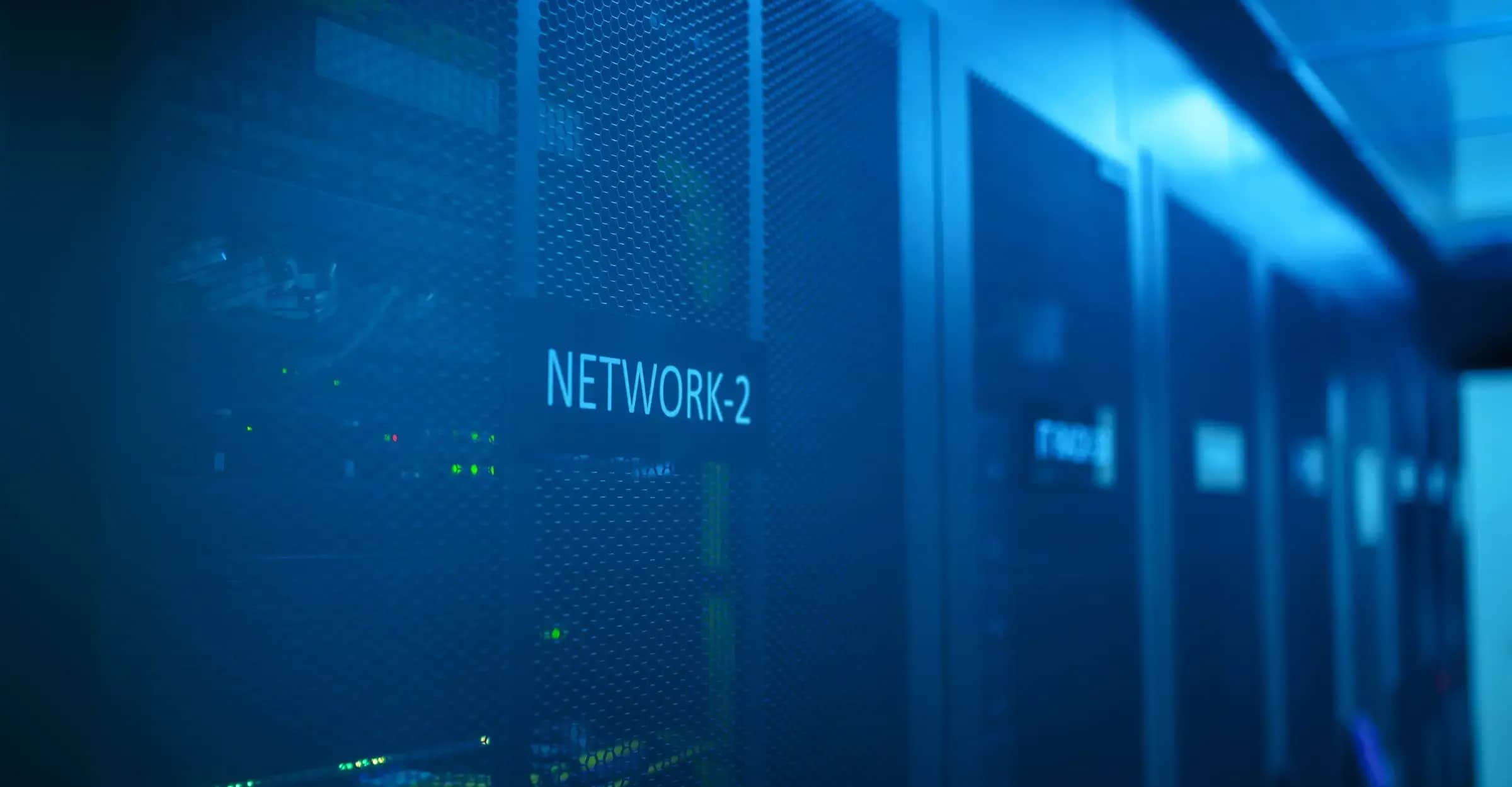 A data centre corridor lit in blue
