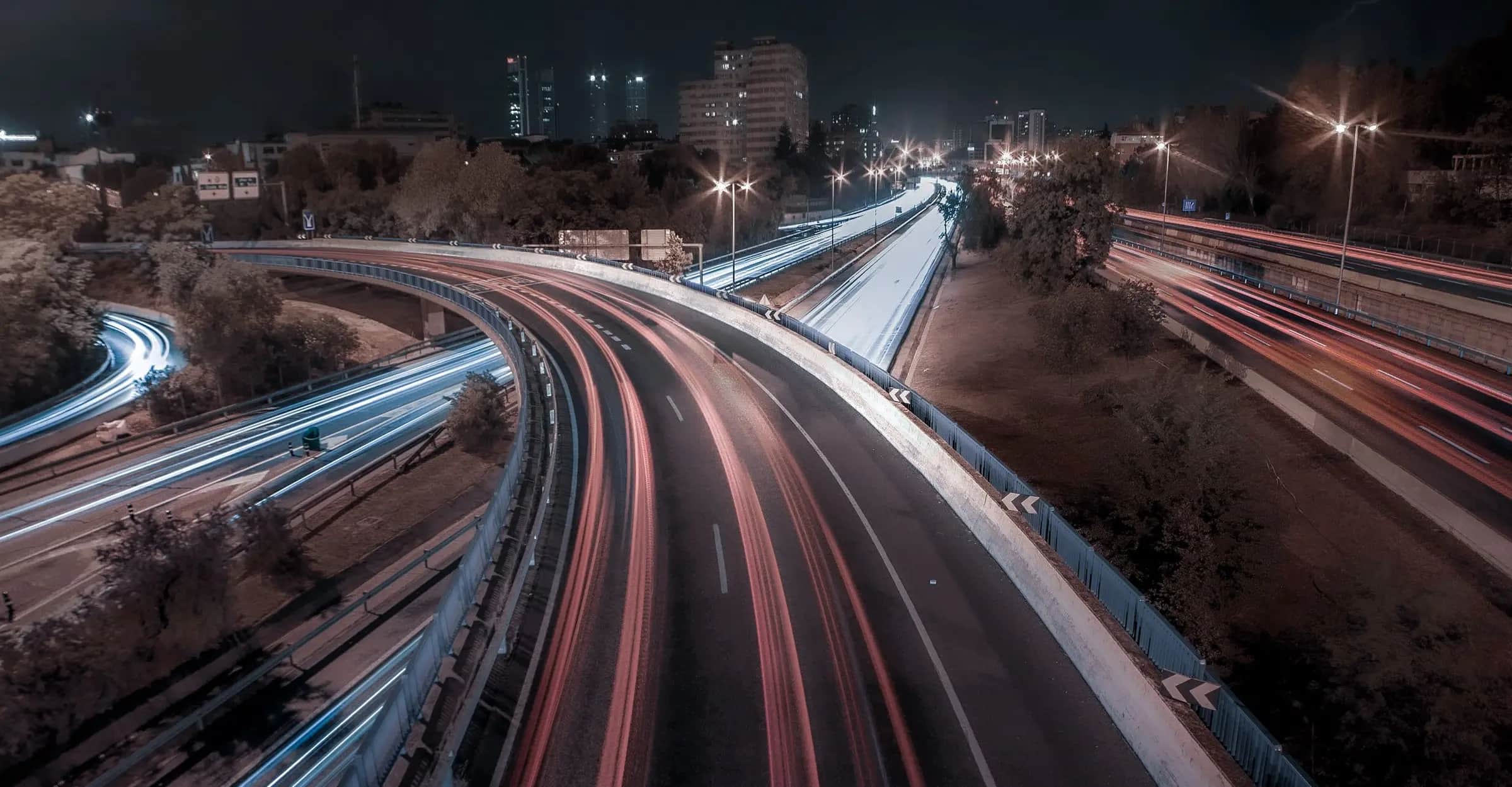 Motorway junction and light trails shot at night with a long exposure